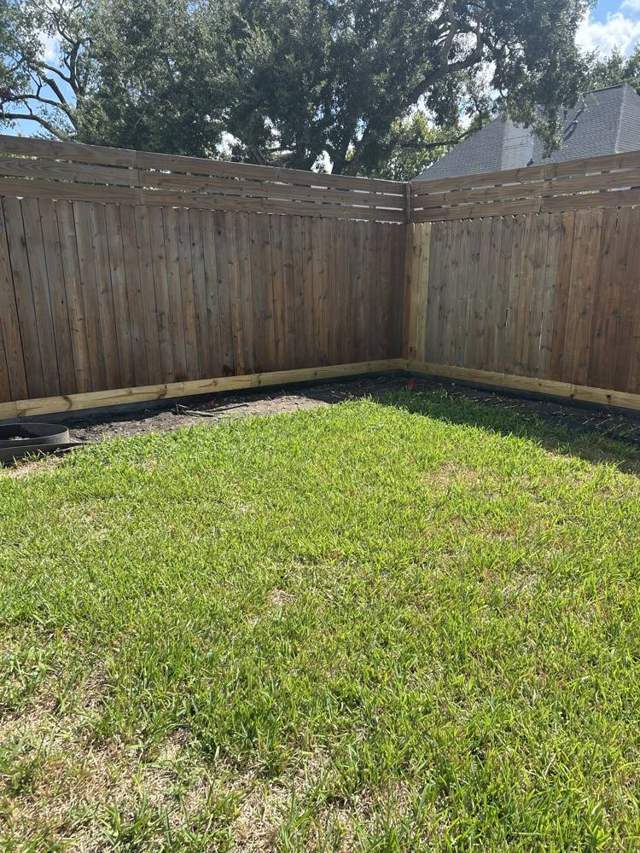 Pressure washed wood fence