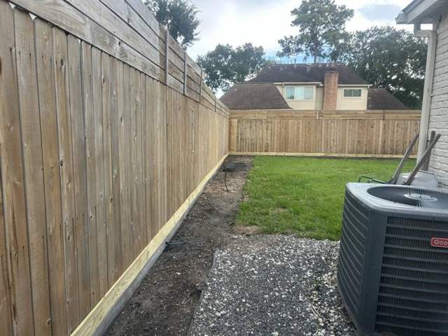 Pressure washed wood fence