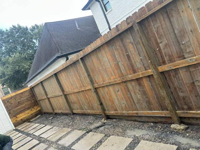 Pressure washed wood fence